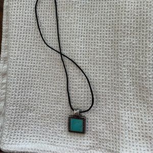 Turquoise square pendant on adjustable satin cord.